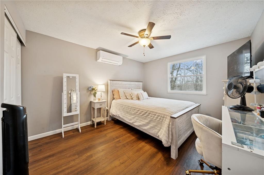 440 Lippencott Run Road Waynesburg, PA 15370 - Photo 15 of 39 a bedroom with a bed and a chandelier