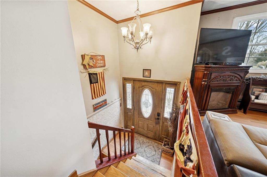 440 Lippencott Run Road Waynesburg, PA 15370 - Photo 16 of 39 a view of a livingroom with wooden floor and flat screen tv