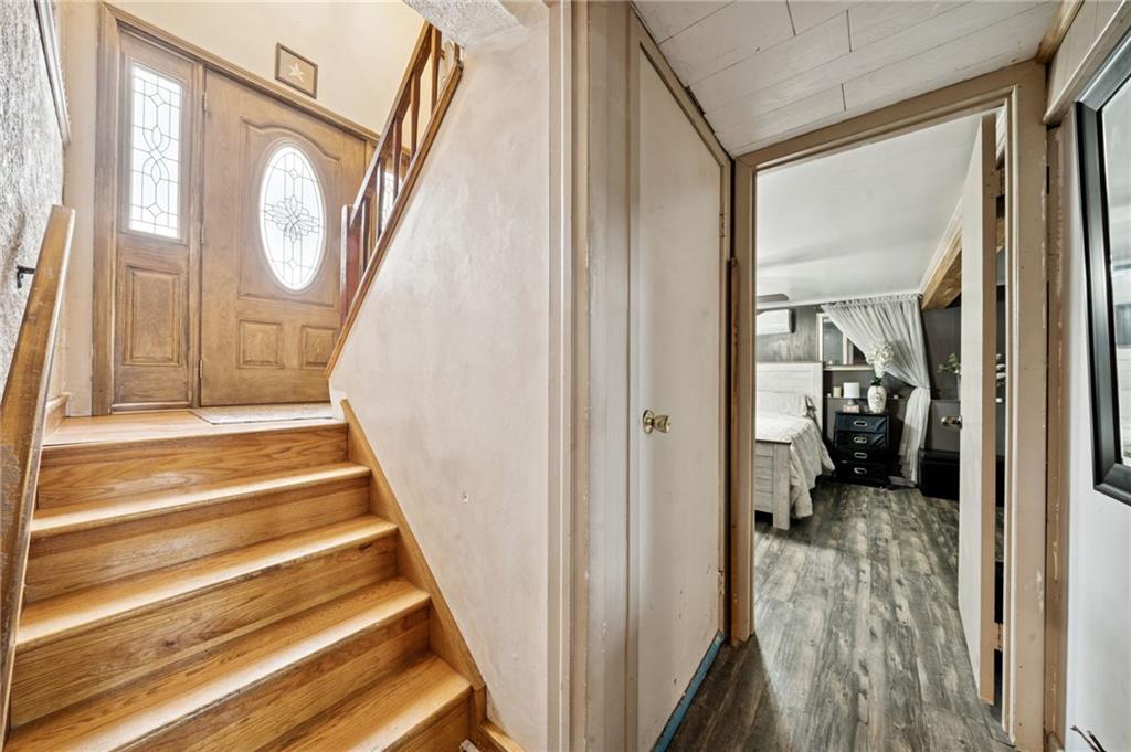440 Lippencott Run Road Waynesburg, PA 15370 - Photo 17 of 39 a view of a hallway with wooden floor and a front door
