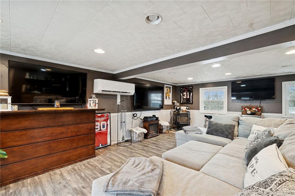 440 Lippencott Run Road Waynesburg, PA 15370 - Photo 20 of 39 a living room with furniture and a flat screen tv