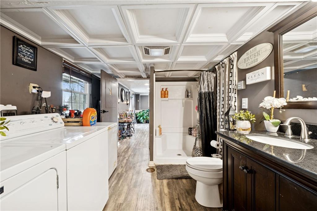 440 Lippencott Run Road Waynesburg, PA 15370 - Photo 24 of 39 a bathroom with a sink vanity granite toilet and a shower
