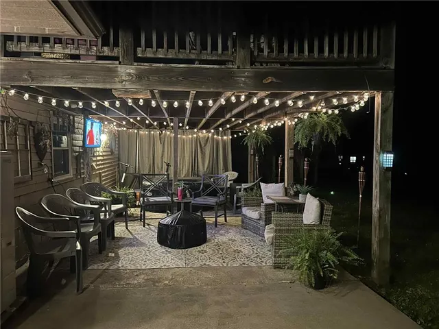 a view of a chairs and tables in patio
