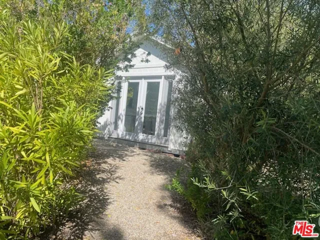 a view of house with yard and outdoor space
