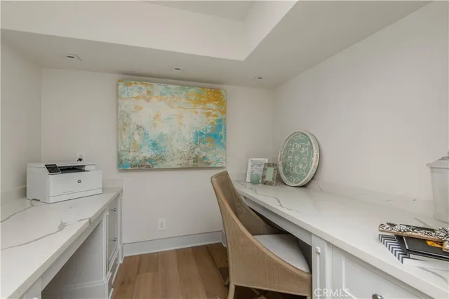 a room with a table chairs and a window