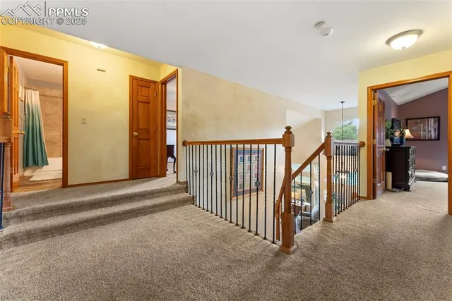 a view of a hallway with staircase