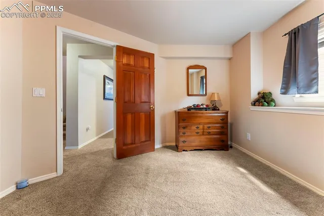 a room that has a dresser and a window