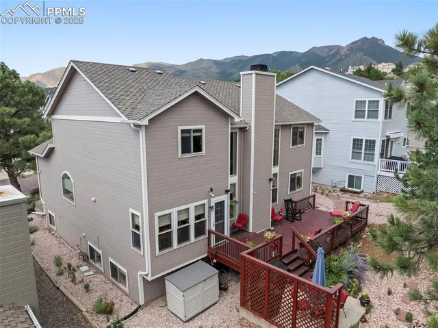 an aerial view of residential houses with a city view