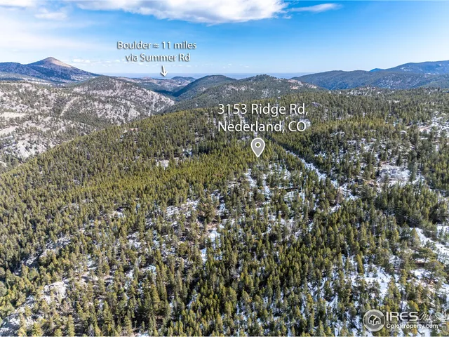 a view of a street with a mountain in the background