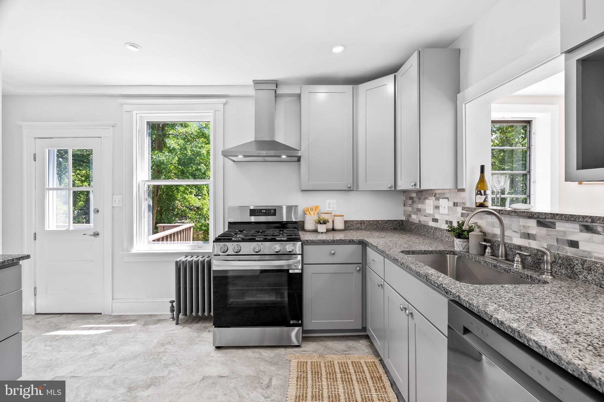 503 Orkney Road Baltimore, MD 21212 - Photo 16 of 43 LG gas 5 burner stove w/ stainless steel vent hood
