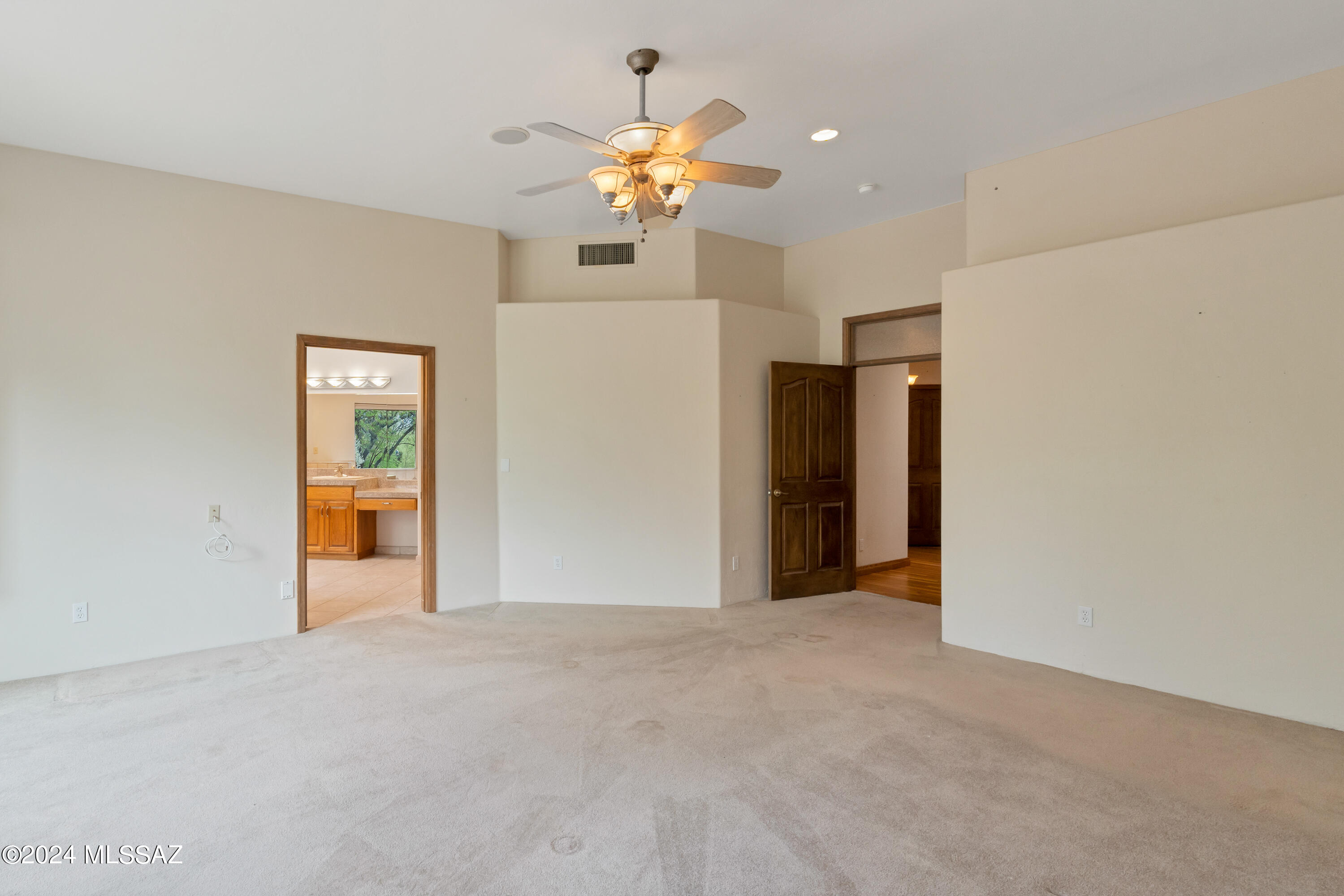 4001 North Harrison Road Tucson, AZ 85749 - Photo 29 of 50 a view of an empty room with a chandelier fan