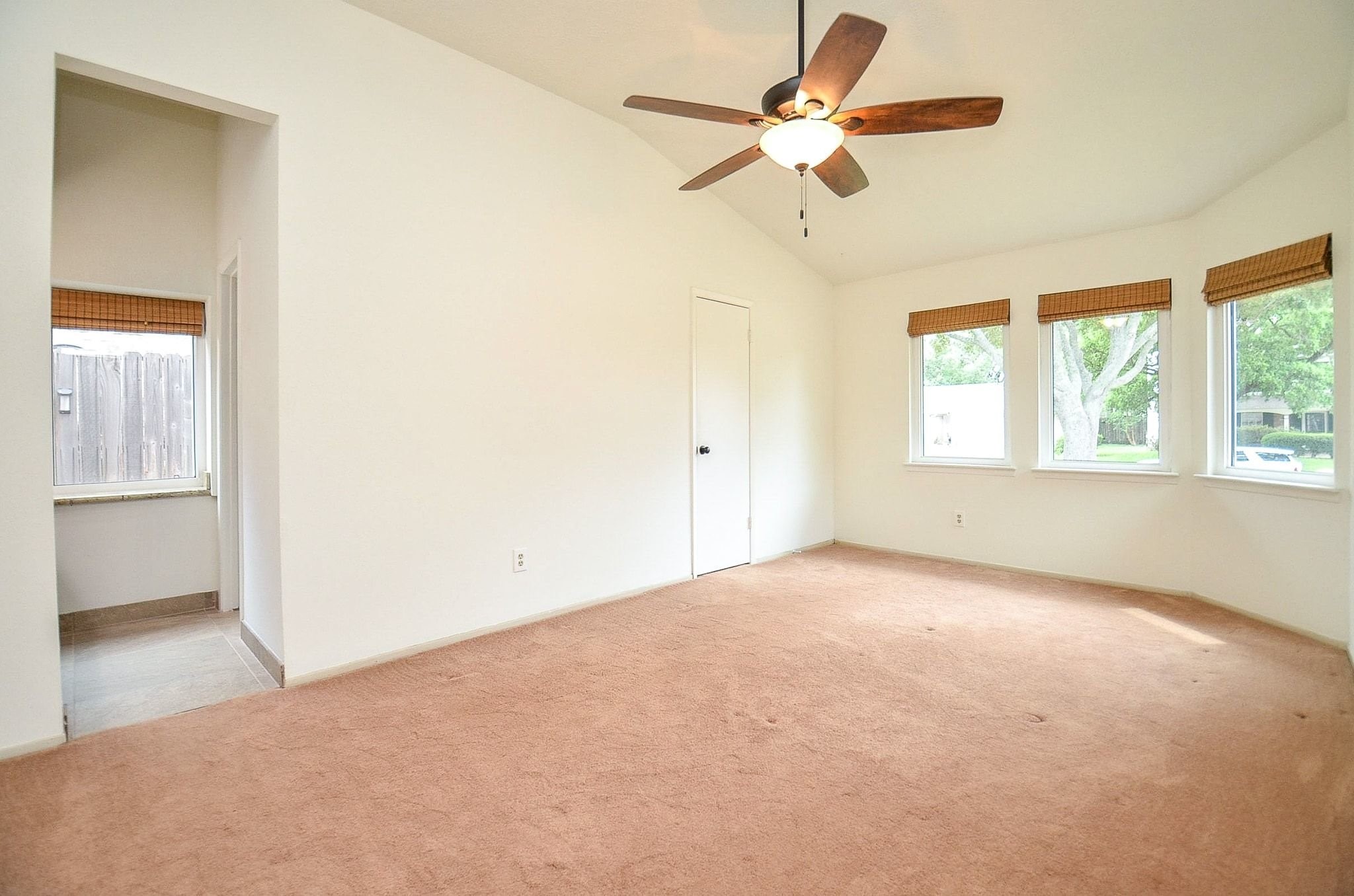 22810 John Rolfe Lane Katy, TX 77449 - Photo 11 of 20 an empty room with a window and a fan