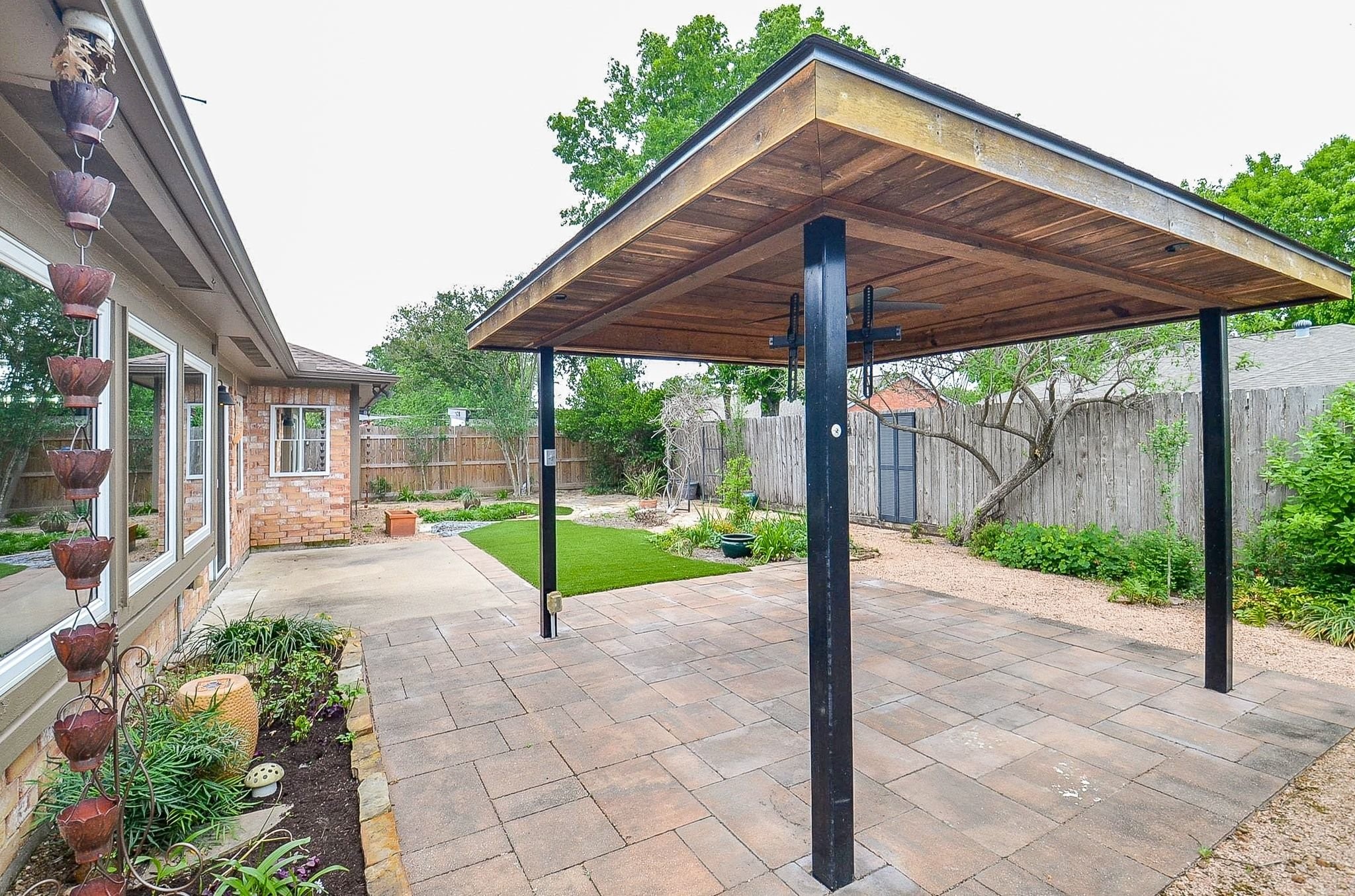 22810 John Rolfe Lane Katy, TX 77449 - Photo 19 of 20 a view of a backyard with a garden and plants
