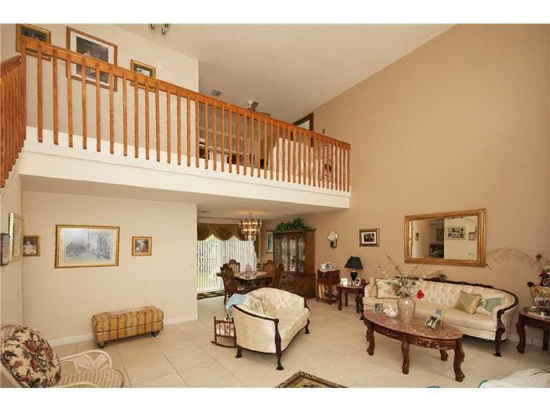 10154 Aqua Vista Way Boca Raton, FL 33428 - Photo 11 of 22 a living room with furniture a rug and a window