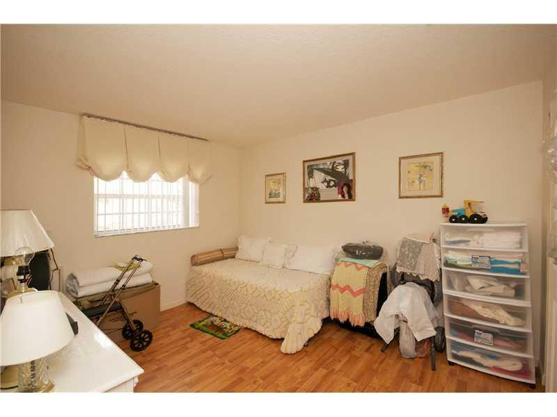 10154 Aqua Vista Way Boca Raton, FL 33428 - Photo 12 of 22 a bedroom with furniture and a window