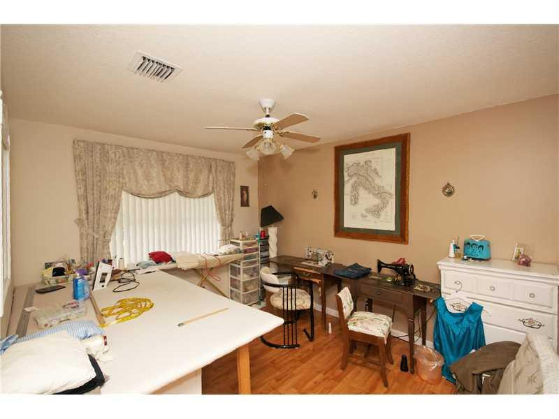 10154 Aqua Vista Way Boca Raton, FL 33428 - Photo 15 of 22 a room with a table chairs and a chandelier
