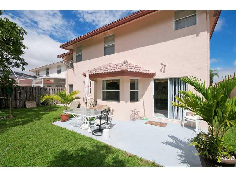10154 Aqua Vista Way Boca Raton, FL 33428 - Photo 19 of 22 a view of a house with backyard sitting area and garden
