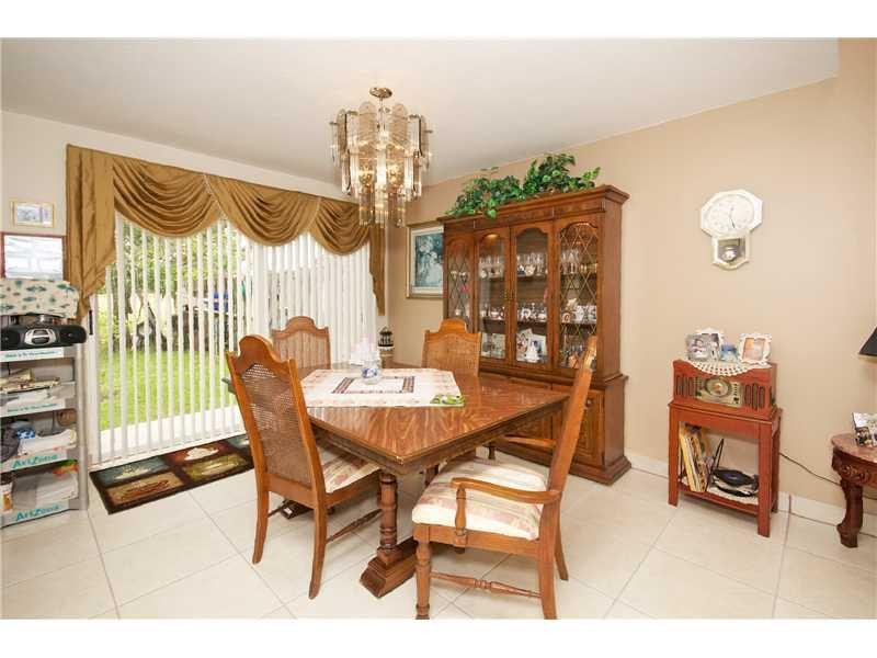 10154 Aqua Vista Way Boca Raton, FL 33428 - Photo 8 of 22 a view of a dining room with furniture and chandelier