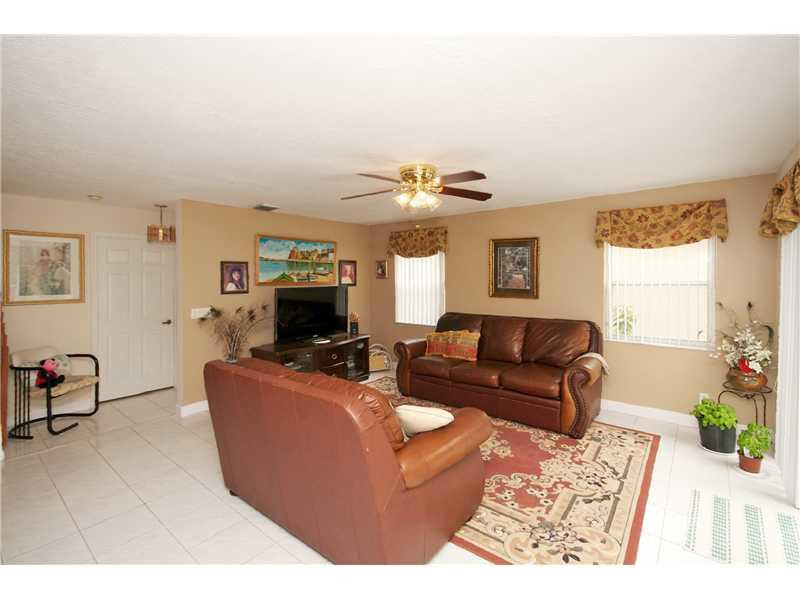 10154 Aqua Vista Way Boca Raton, FL 33428 - Photo 9 of 22 a living room with furniture and a fireplace
