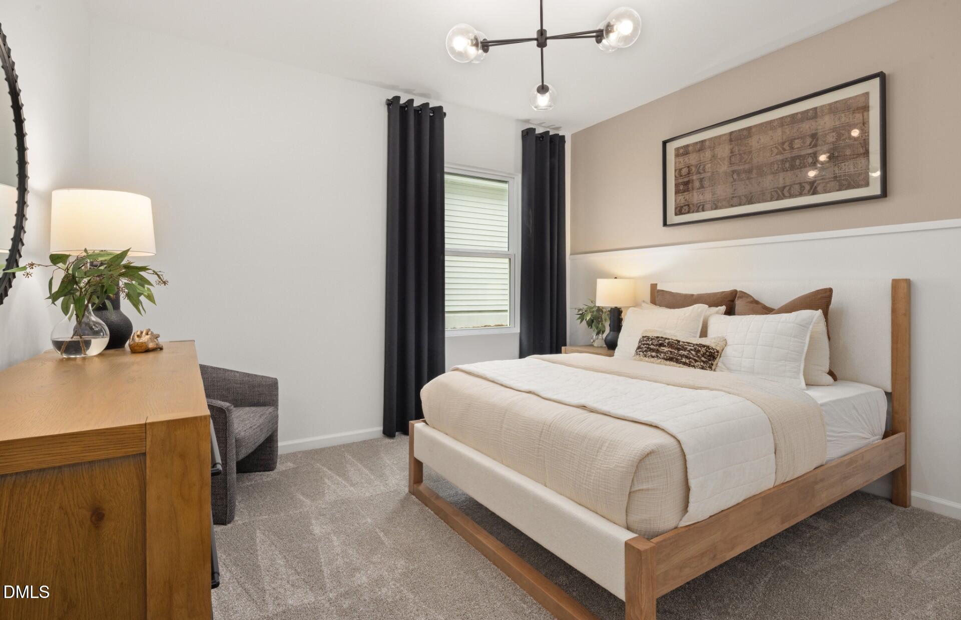 605 Timber Terrace Drive Durham, NC 27704 - Photo 5 of 31 a bedroom with a bed and a desk