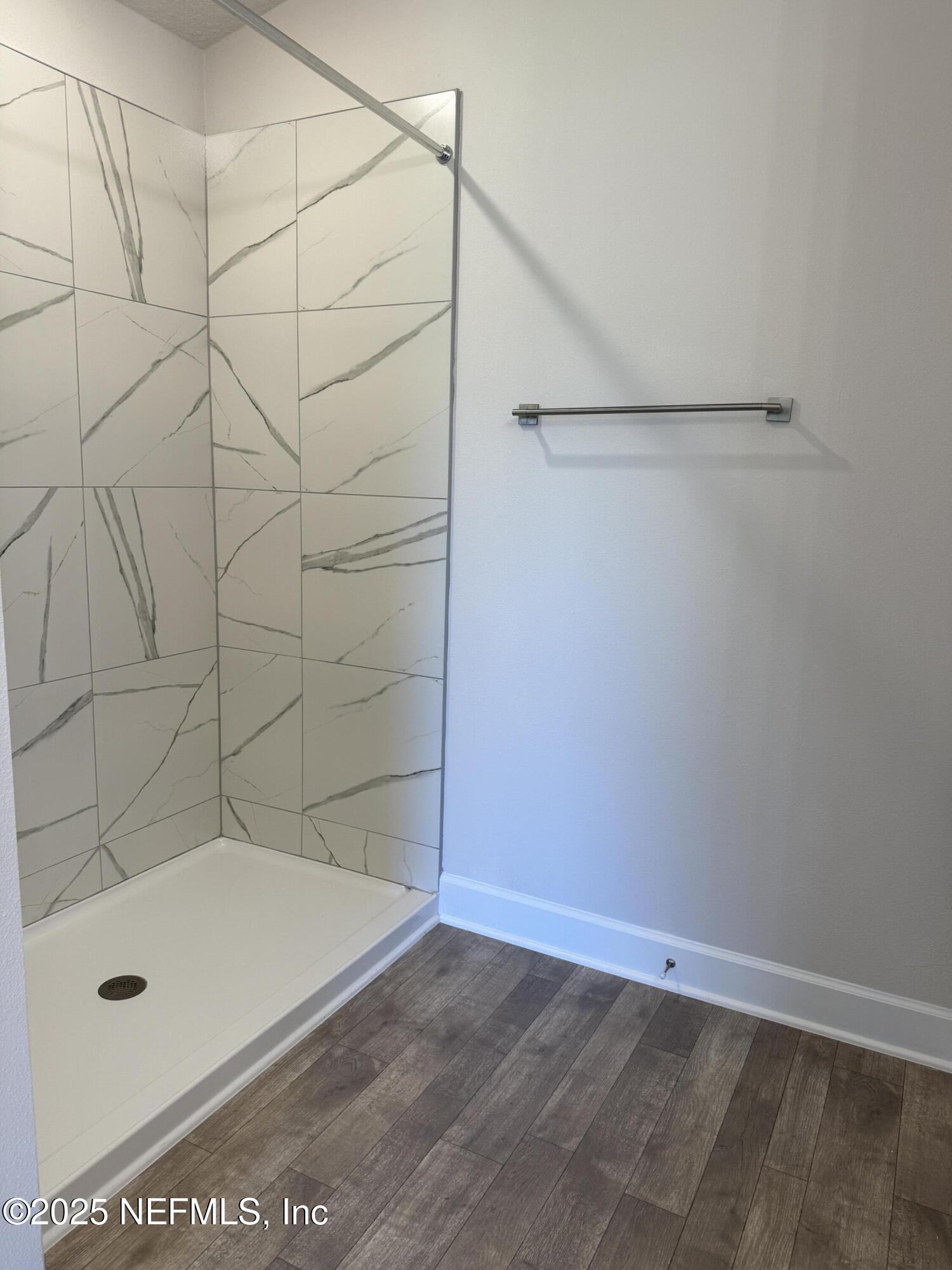 8340 Helmsley Boulevard Jacksonville, FL 32219 - Photo 13 of 56 a bathroom with a bath tub