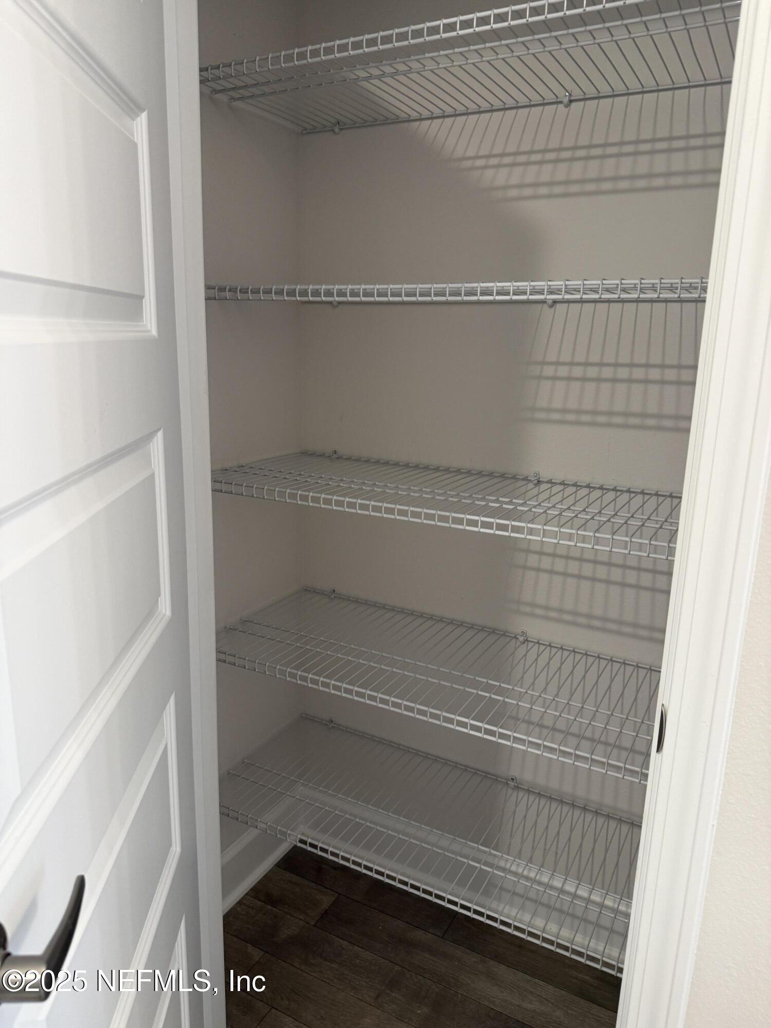 8340 Helmsley Boulevard Jacksonville, FL 32219 - Photo 15 of 56 a view of walk in closet with empty racks