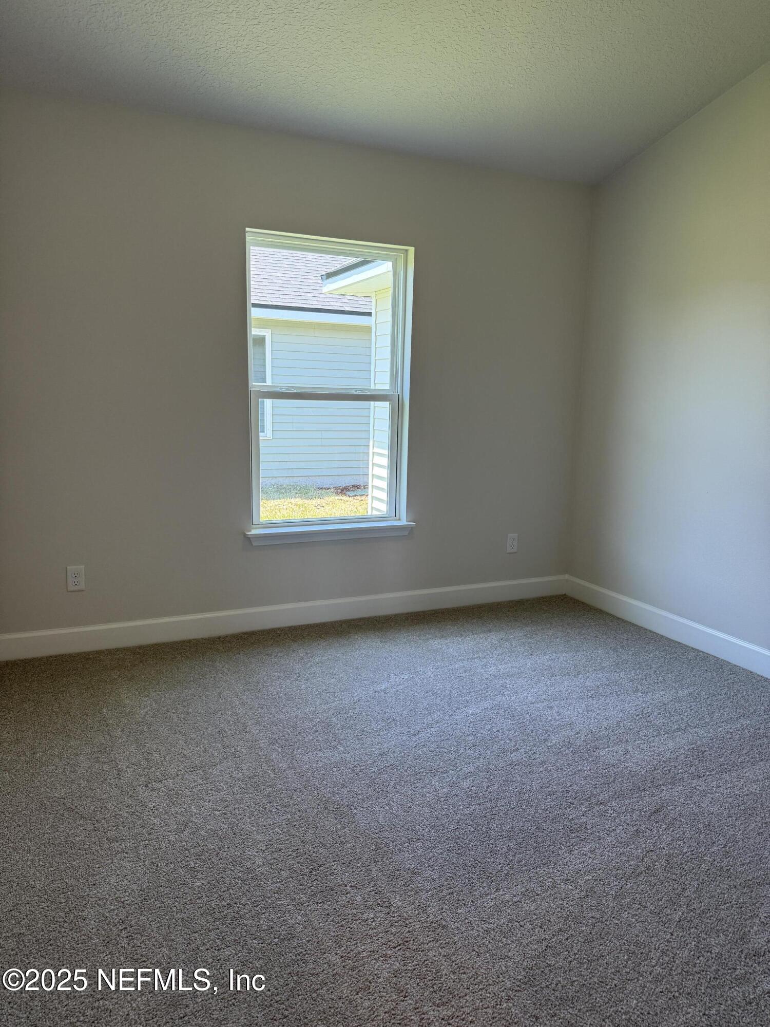 8340 Helmsley Boulevard Jacksonville, FL 32219 - Photo 19 of 56 an empty room with a window