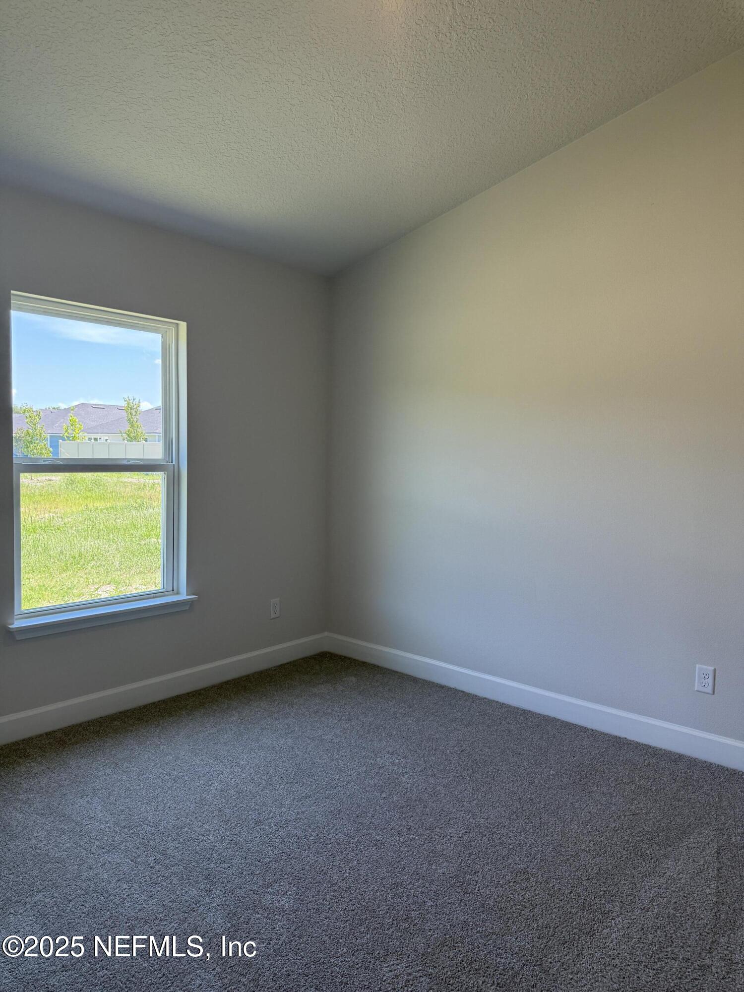 8340 Helmsley Boulevard Jacksonville, FL 32219 - Photo 23 of 56 an empty room with a window