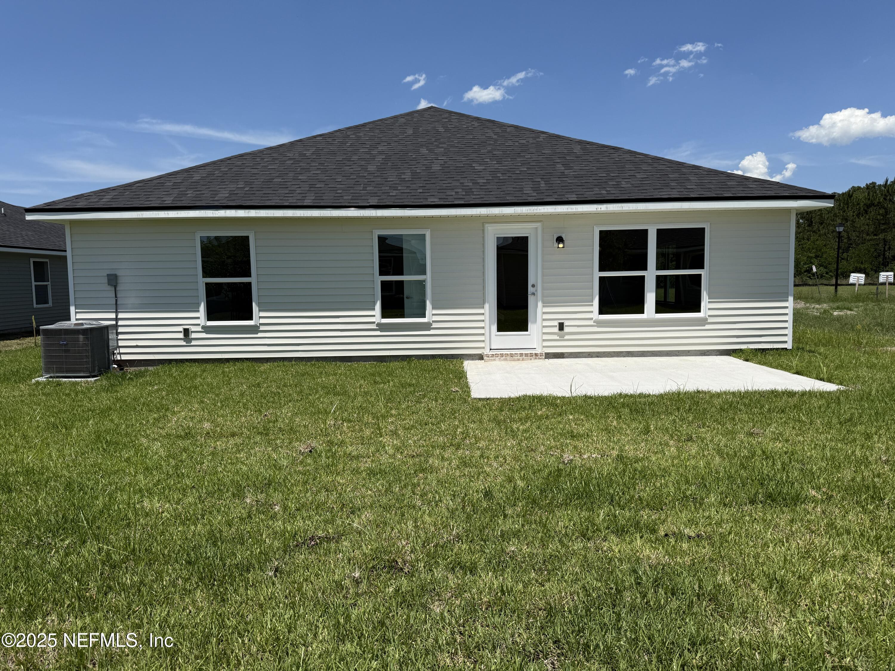 8340 Helmsley Boulevard Jacksonville, FL 32219 - Photo 25 of 56 front view of house with a yard