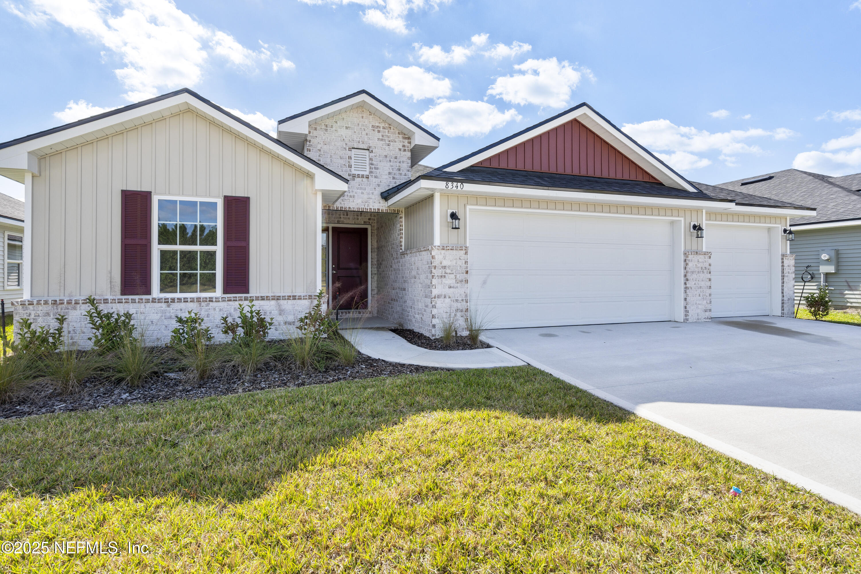 8340 Helmsley Boulevard Jacksonville, FL 32219 - Photo 30 of 56 a front view of a house with garden