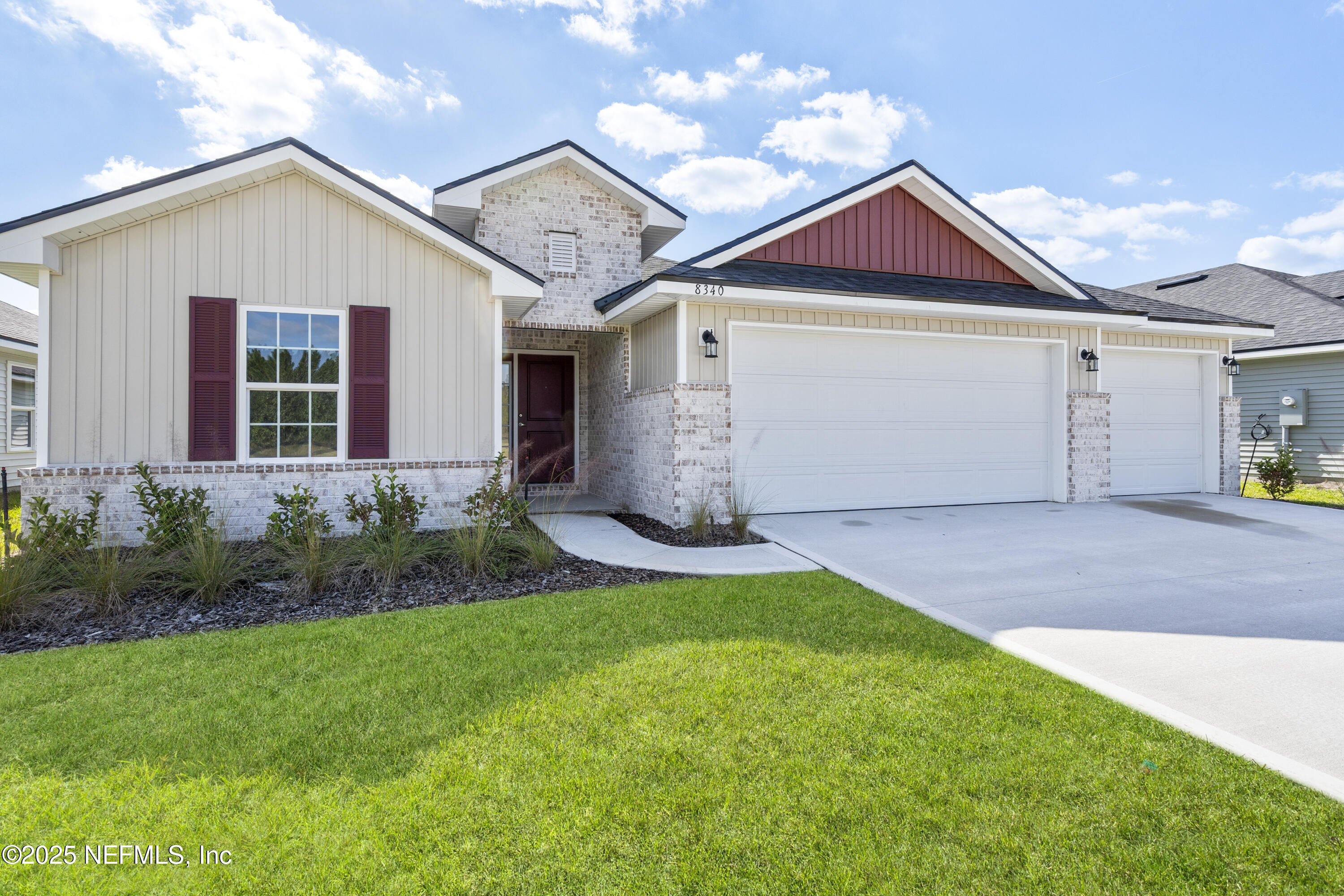 8340 Helmsley Boulevard Jacksonville, FL 32219 - Photo 31 of 56 a front view of a house with a yard and garage