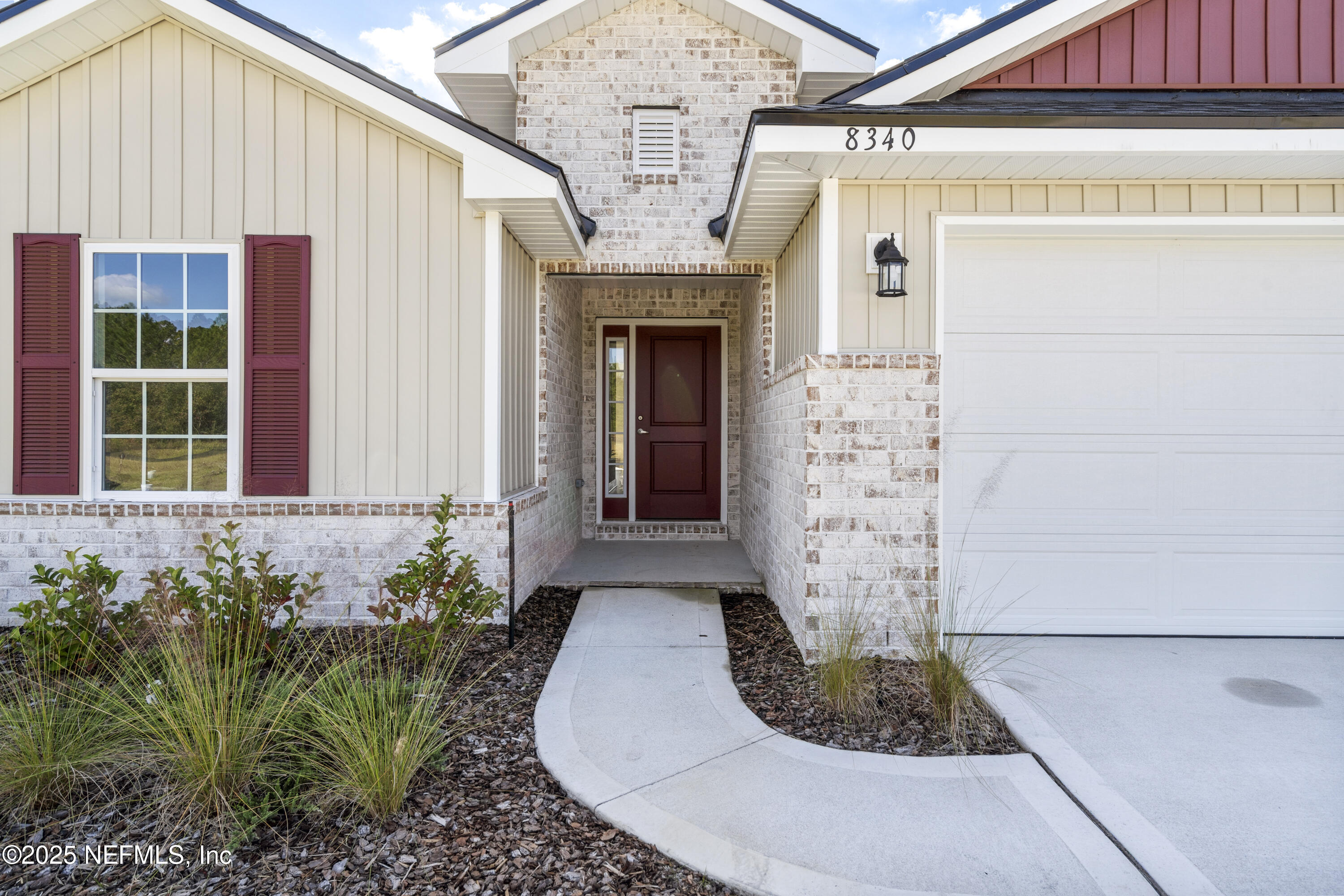 8340 Helmsley Boulevard Jacksonville, FL 32219 - Photo 32 of 56 a front view of a house with plants