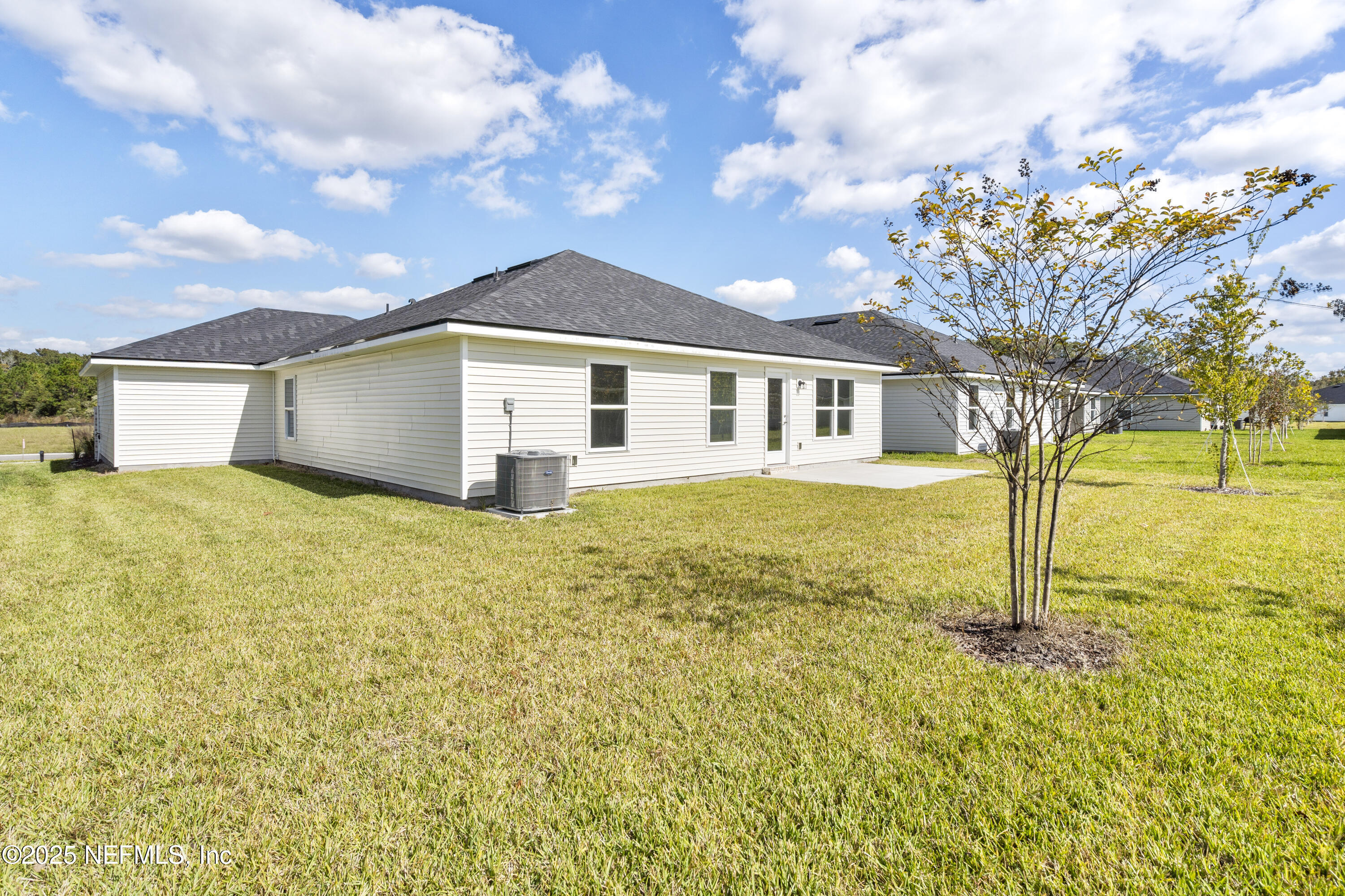 8340 Helmsley Boulevard Jacksonville, FL 32219 - Photo 33 of 56 a view of a house with a yard
