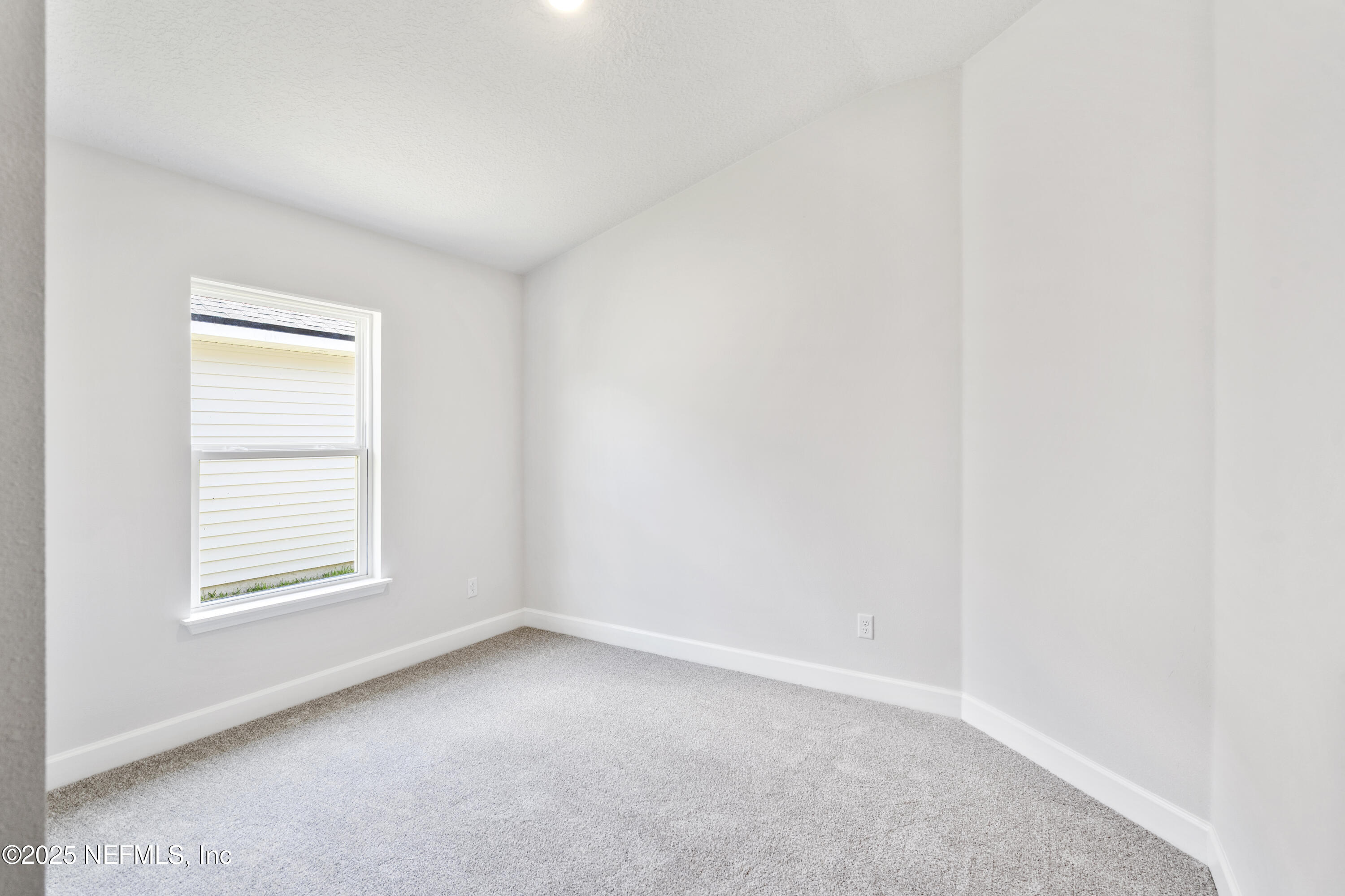 8340 Helmsley Boulevard Jacksonville, FL 32219 - Photo 41 of 56 an empty room with a window