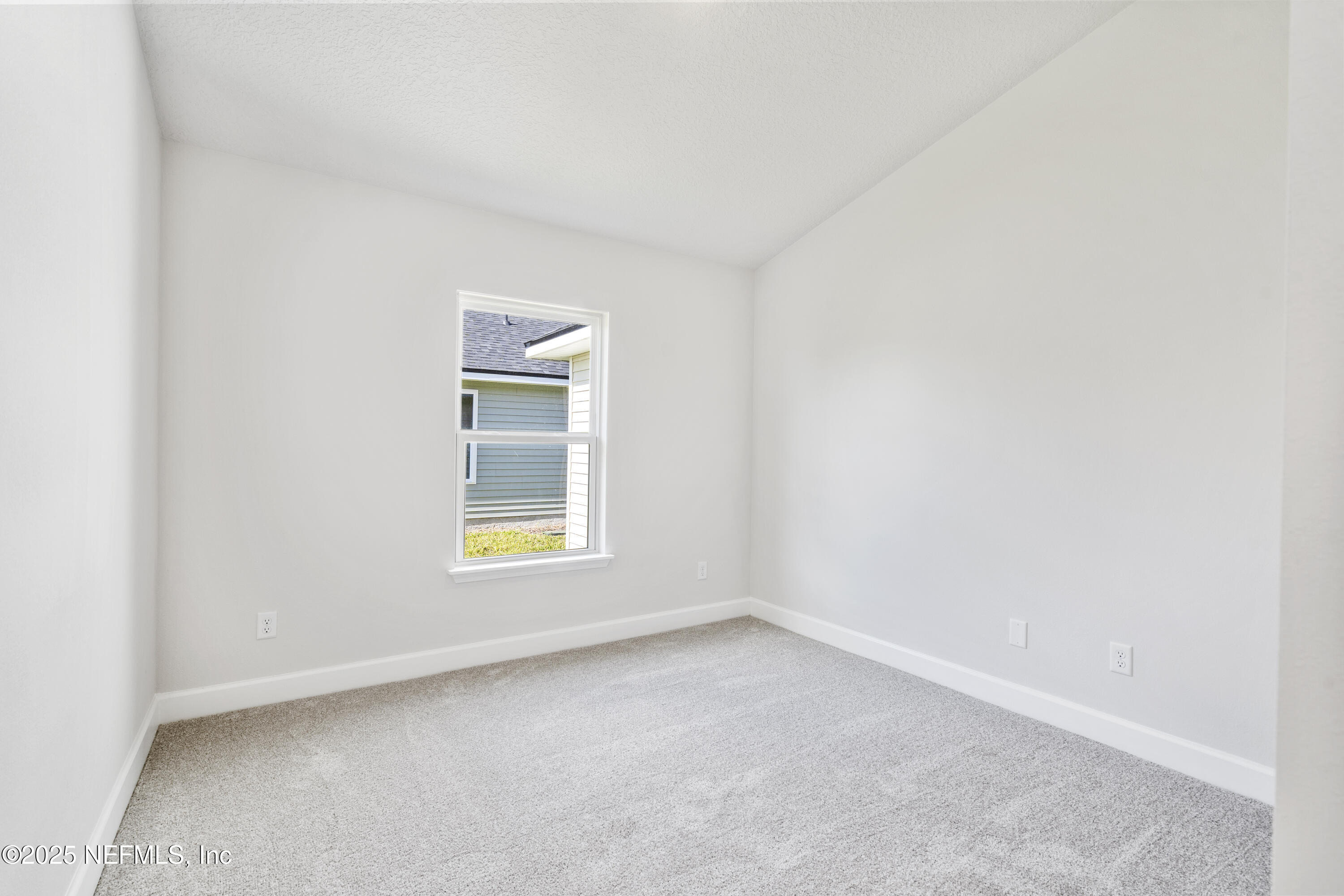 8340 Helmsley Boulevard Jacksonville, FL 32219 - Photo 42 of 56 an empty room with a window