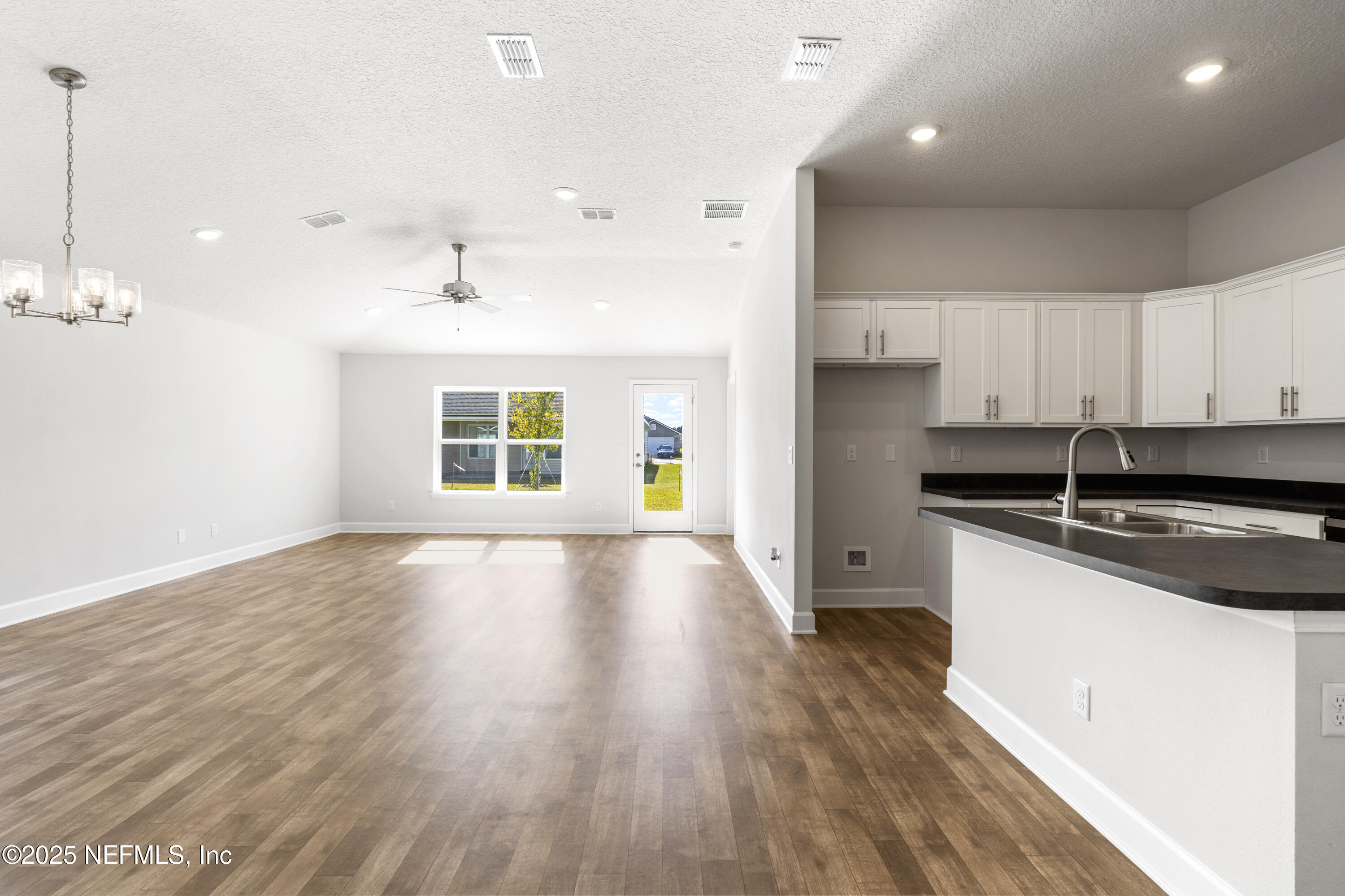 8340 Helmsley Boulevard Jacksonville, FL 32219 - Photo 43 of 56 a view of a kitchen with a sink and wooden floor