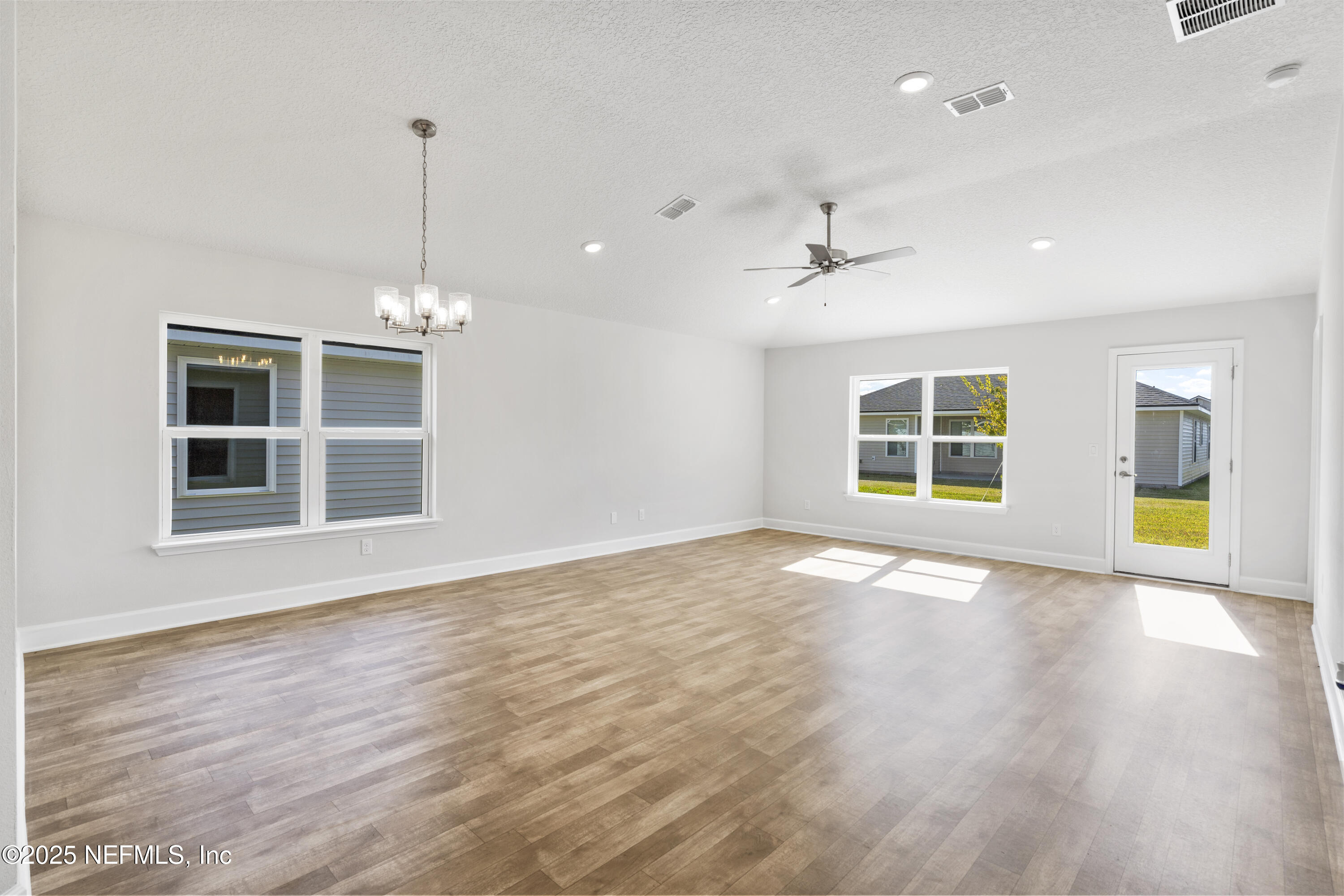 8340 Helmsley Boulevard Jacksonville, FL 32219 - Photo 44 of 56 a view of an empty room with a window and wooden floor