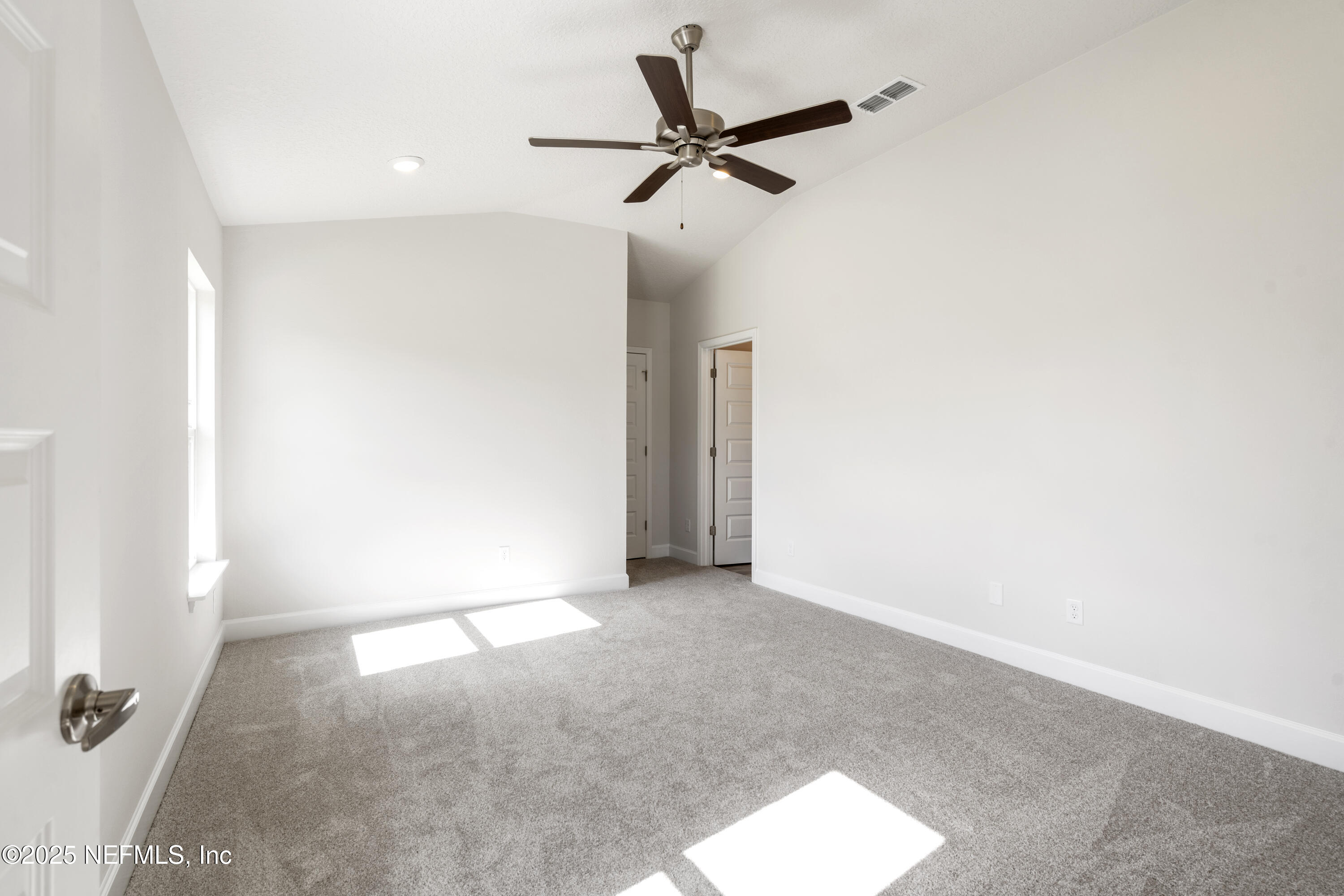8340 Helmsley Boulevard Jacksonville, FL 32219 - Photo 52 of 56 a view of a room with a ceiling fan