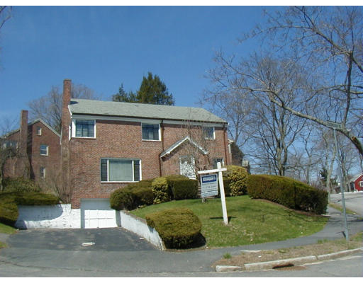 8 Goodnough Road Brookline, MA 02467 - Photo 1 of 1 a front view of a house with garden