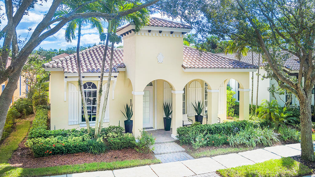 317 Galicia Way Jupiter, FL 33458 - Photo 14 of 31 a front view of a house with garden