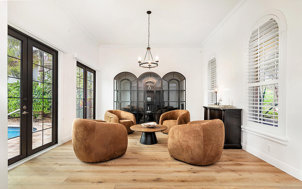 317 Galicia Way Jupiter, FL 33458 - Photo 15 of 31 a living room with couches a large mirror with wooden floor