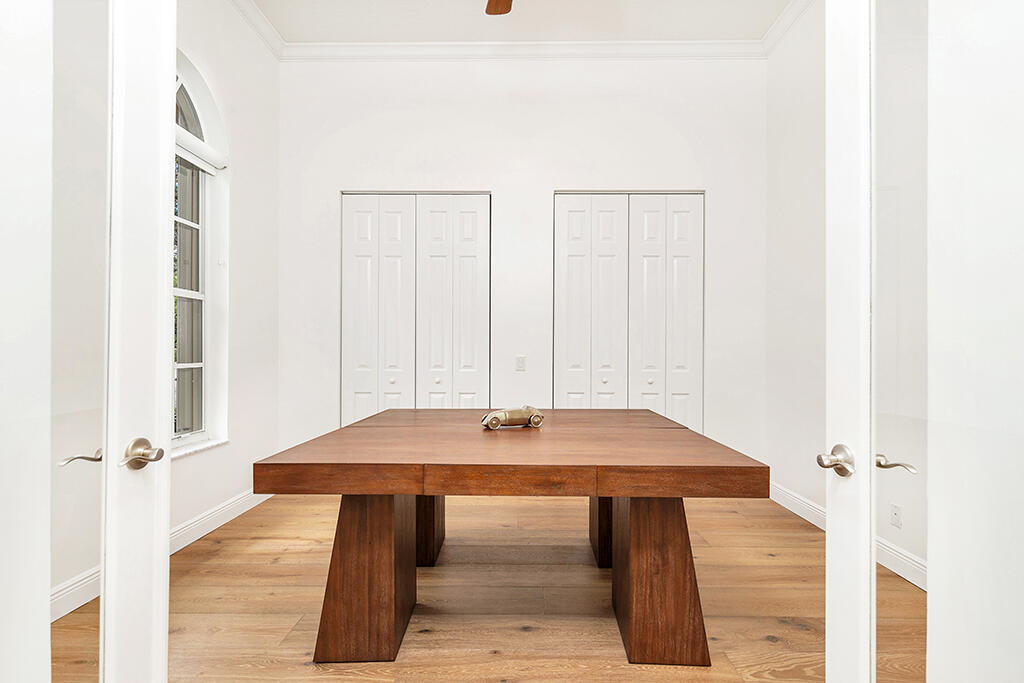 317 Galicia Way Jupiter, FL 33458 - Photo 16 of 31 a view of a room with a table and chairs