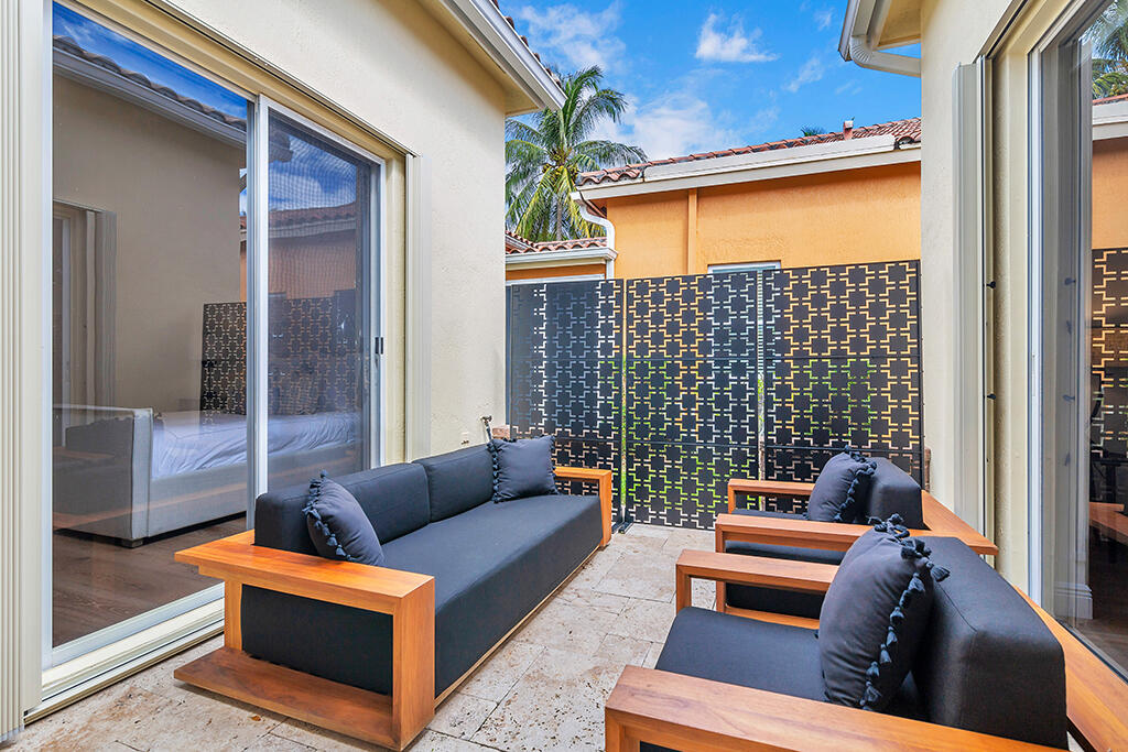 317 Galicia Way Jupiter, FL 33458 - Photo 24 of 31 a outdoor living room with furniture