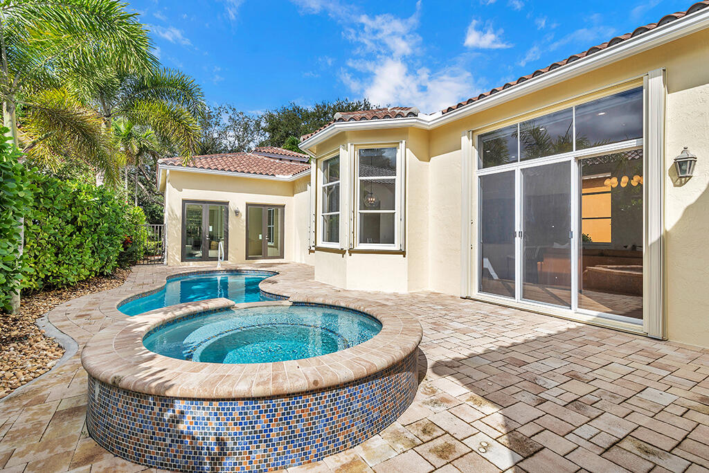 317 Galicia Way Jupiter, FL 33458 - Photo 25 of 31 a view of outdoor space yard deck patio and swimming pool