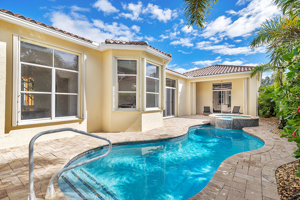 317 Galicia Way Jupiter, FL 33458 - Photo 27 of 31 a view of a house with swimming pool and sitting area