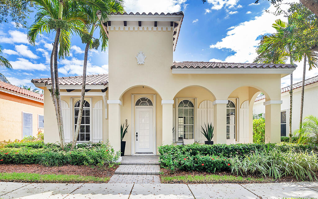 317 Galicia Way Jupiter, FL 33458 - Photo 29 of 31 a front view of a house with garden