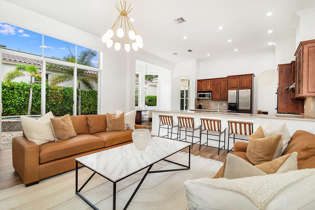 317 Galicia Way Jupiter, FL 33458 - Photo 7 of 31 a living room with furniture and a large window