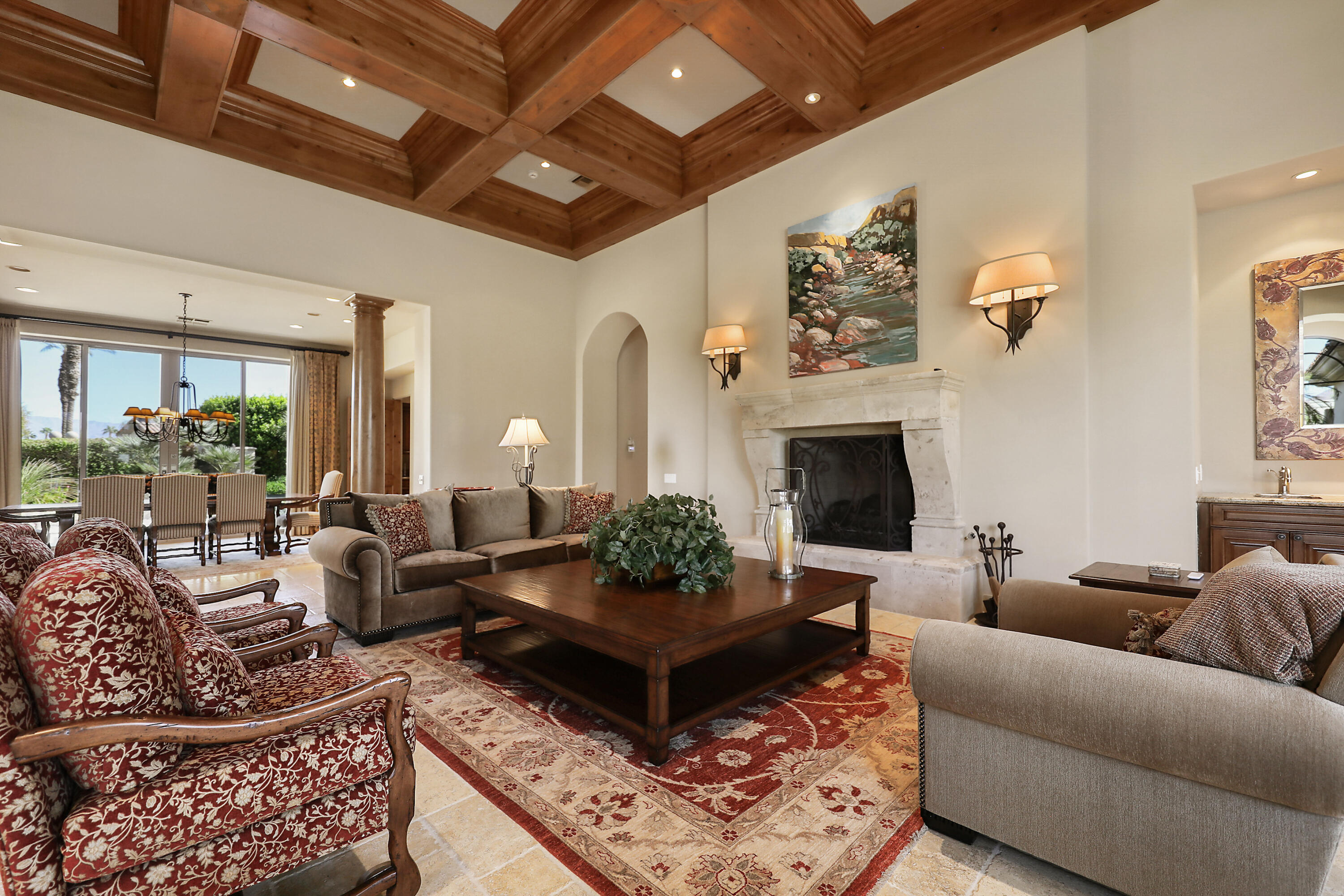 50360 Woodmere La Quinta, CA 92253 - Photo 11 of 56 a living room with furniture windows and a fireplace