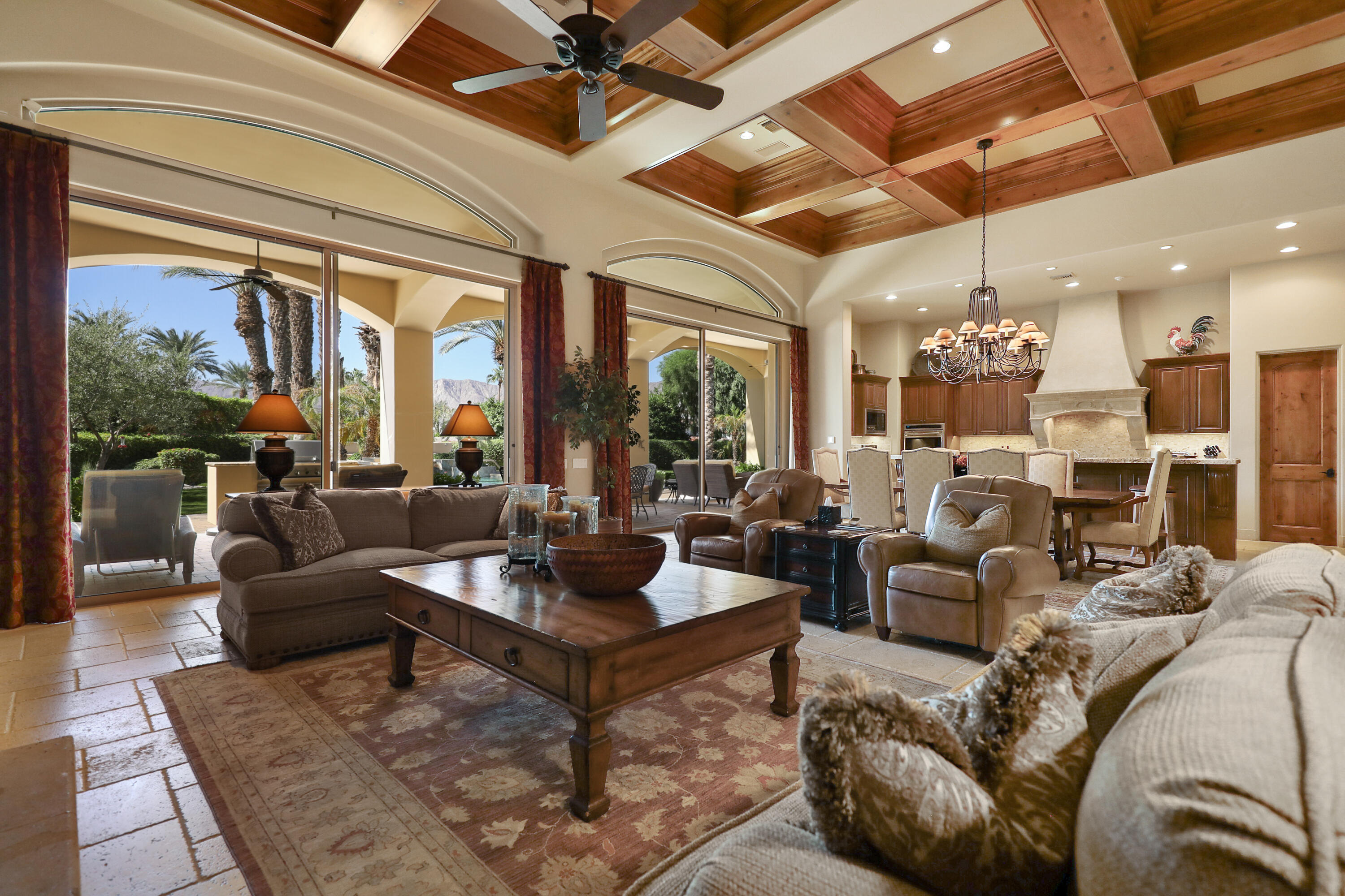50360 Woodmere La Quinta, CA 92253 - Photo 15 of 56 a living room with furniture large windows and wooden floor