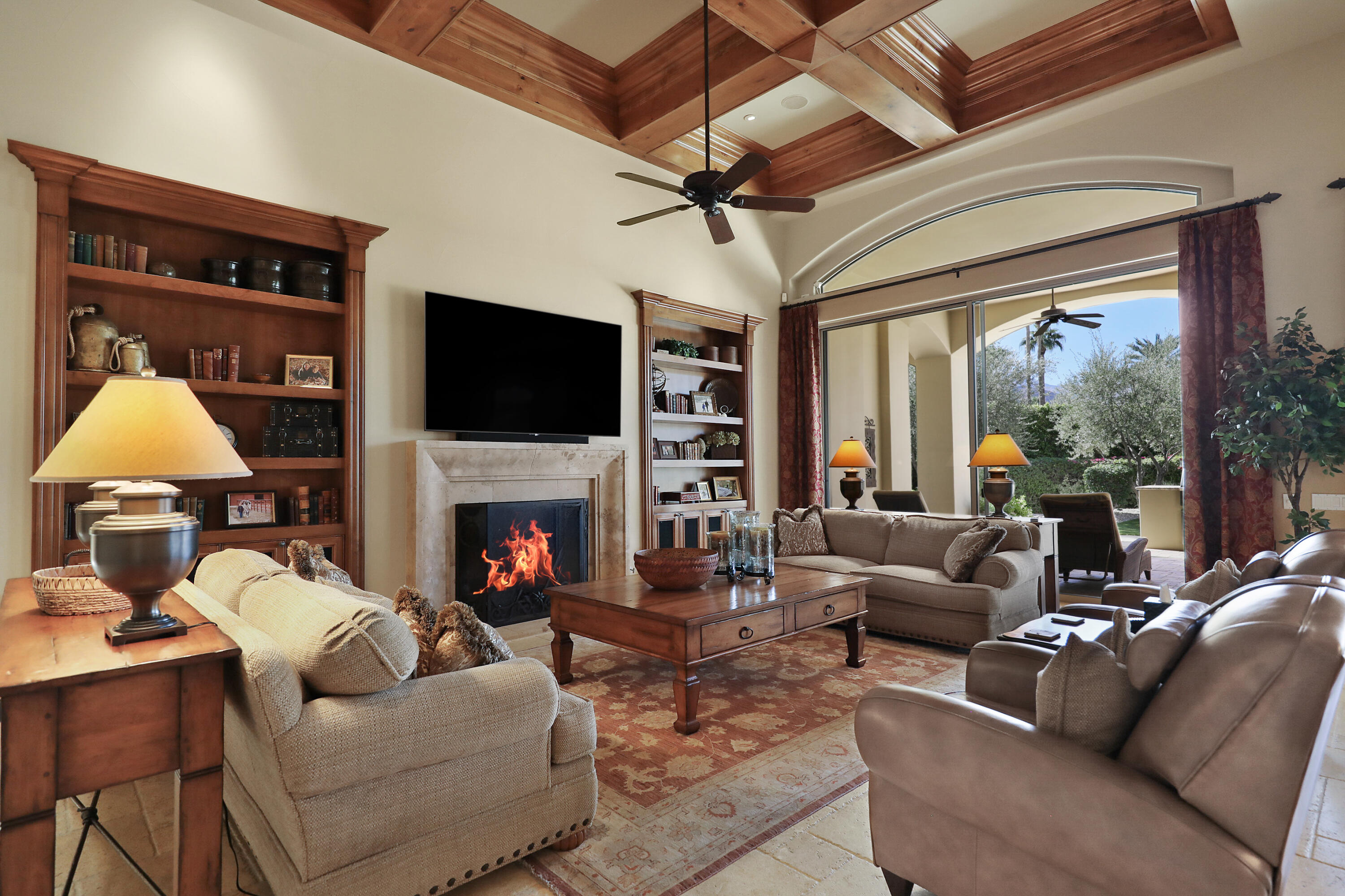 50360 Woodmere La Quinta, CA 92253 - Photo 16 of 56 a living room with furniture a fireplace and a flat screen tv