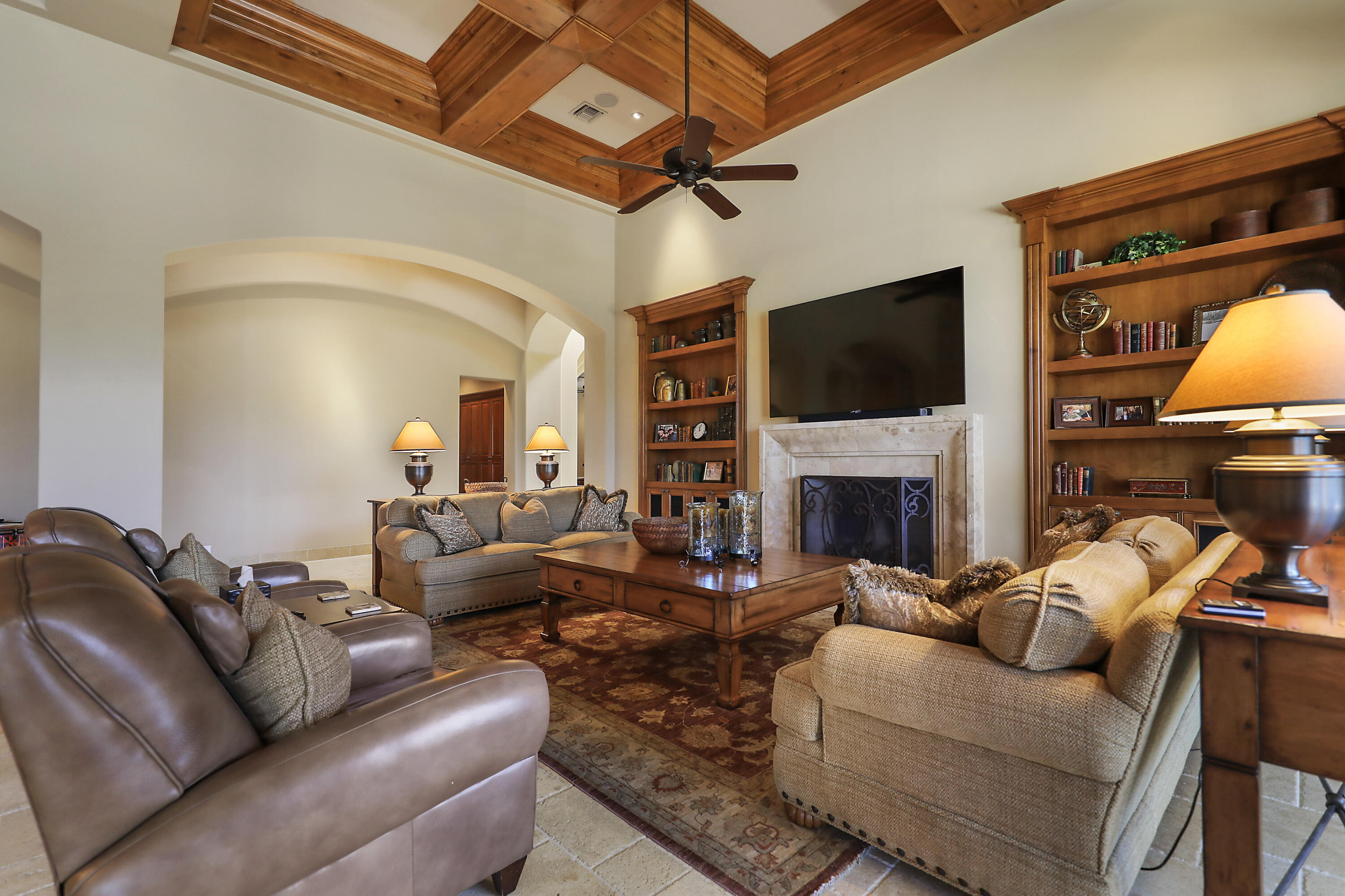 50360 Woodmere La Quinta, CA 92253 - Photo 17 of 56 a living room with furniture a fireplace and a flat screen tv